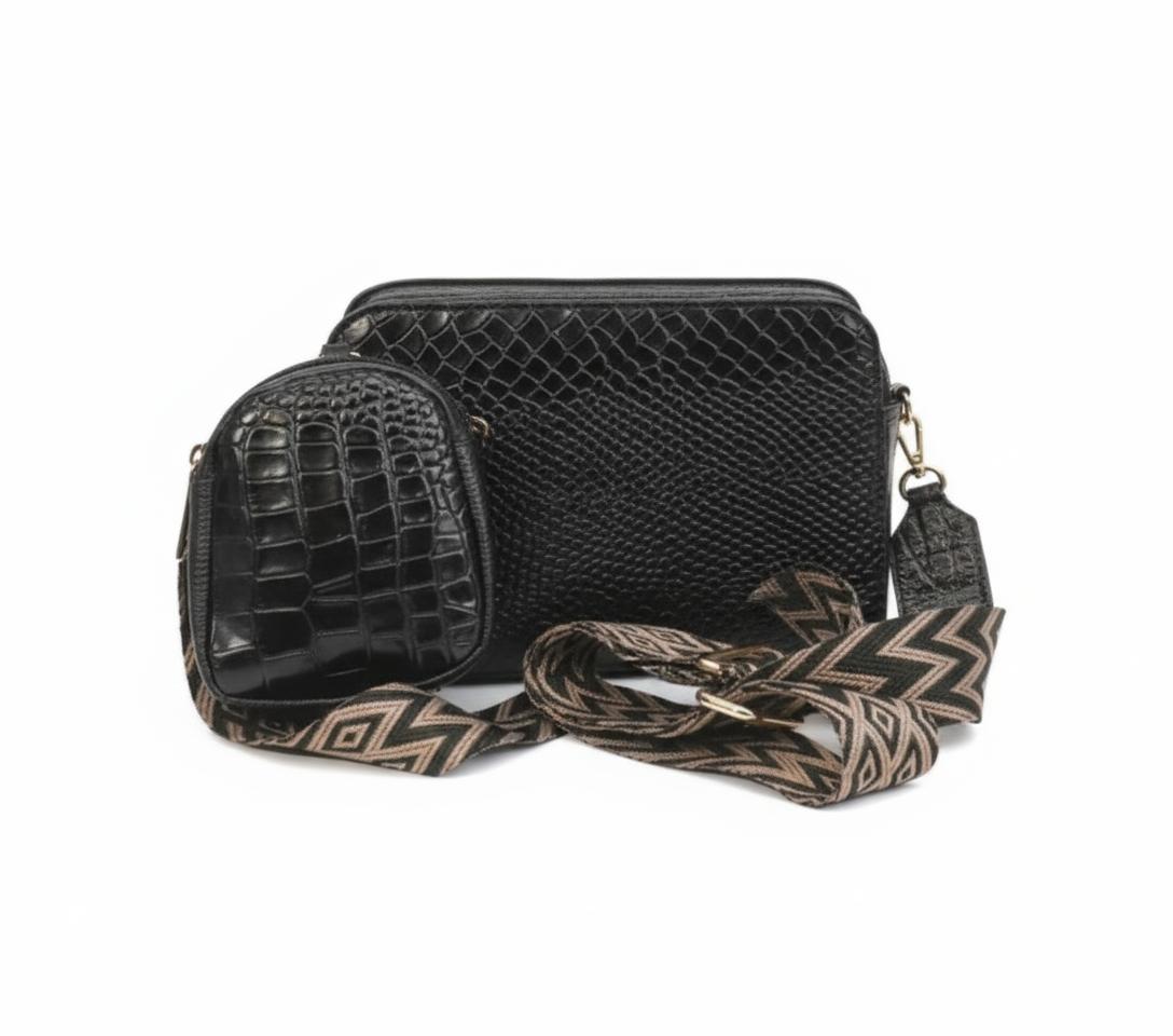 Leather Crossbody bag with embossed texture and patterned strap.